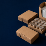 co manufacturer - Korpack - Packaging Solutions for Complex Businesses Boxes and crates filled with canned goods and wrapped packages, arranged for shipment on a dark blue surface.