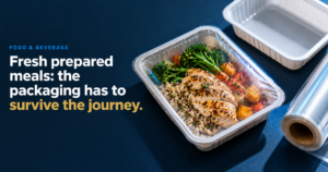 Fresh Meals Strong Packaging - Korpack - Packaging Solutions for Complex Businesses Hero image showing a sealed plastic meal tray with sliced grilled chicken, broccoli, and roasted vegetables on a dark blue background; includes the text 'Fresh prepared meals: the packaging has to survive the journey.'