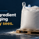 The Ingredient Packaging Nobody Sees - Korpack - Packaging Solutions for Complex Businesses Bulk white bag on a wooden pallet against a dark blue backdrop, with the headline: 'The ingredient packaging nobody sees.'