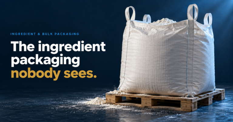 The Ingredient Packaging Nobody Sees - Korpack - Packaging Solutions for Complex Businesses Bulk white bag on a wooden pallet against a dark blue backdrop, with the headline: 'The ingredient packaging nobody sees.'